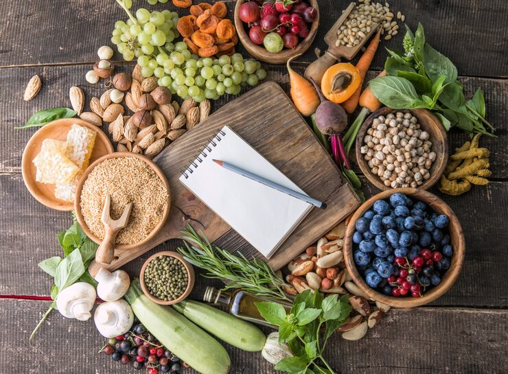 Bright wholesome ingredients arranged on a timber table for Liveavitaol mindful meals chapter